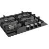 Angled view of black glass surface with burner spacing