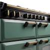Close up of the dials on the Rangemaster 110cm classic deluxe dual fuel range cooker with brass trim