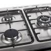 Close-up of five gas burners with cast iron pan supports