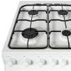 Close-up of four gas burners with enamel pan supports