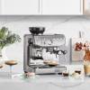 Front view of Sage Barista Express Impress espresso machine in stainless steel finish