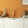 Gold Quooker Fusion Square Tap delivering hot, cold, boiling, chilled and sparkling water