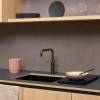 Gunmetal Quooker Fusion Square Tap delivering hot, cold, boiling, chilled and sparkling water