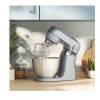 Kenwood Go Stand Mixer in Storm Blue on kitchen counter in use