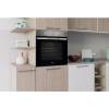 Lifestyle image of Indesit IO232HXUK installed in a modern stainless steel kitchen