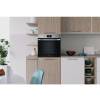 Lifestyle image of Indesit IO253XUK installed in a contemporary stainless steel kitchen