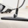 Miele CX1COMFORT cleaning multiple surfaces including tile and carpet