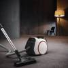 Miele vacuum in use on tile, carpet, and laminate floors