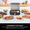 Ninja GR101UK Sizzle Grill & Flat Plate open surrounded by food