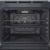 Open view of Indesit IO232HW showing interior shelves and bright oven lighting