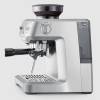 Sage Barista Express 54mm portafilter with freshly ground coffee dose