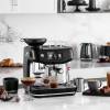 Sage Oracle Jet touchscreen with café-style drinks menu on kitchen countertop