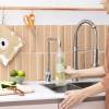 Showing the Quooker Nordic Square Polished Chrome Single Tap being used to fill a bottle