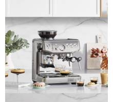 Front view of Sage Barista Express Impress espresso machine in stainless steel finish