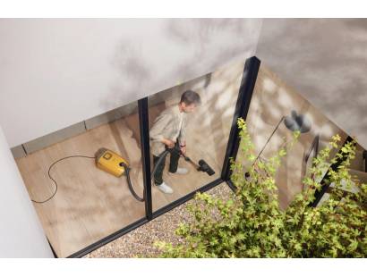 Bold Sunset Yellow vacuum cleaning all floor types in modern home