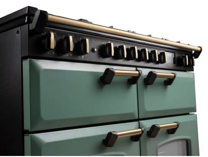 Close up of the dials on the Rangemaster 110cm classic deluxe dual fuel range cooker with brass trim