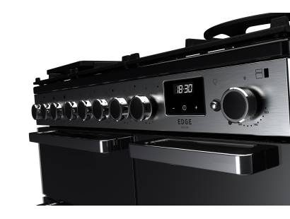 Close-up of Rangemaster EDDL90DFGBLKCM1 control panel and black glass finish with chrome detailing