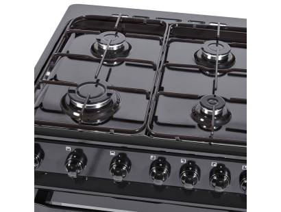Close-up of enamel pan supports and four gas burners