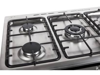 Close-up of five gas burners with cast iron pan supports
