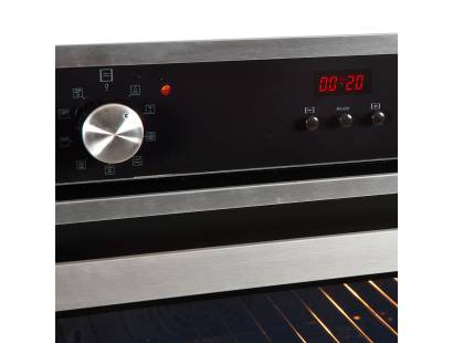 Close-up of the digital programmer and stainless steel control dials on the SOC316IX