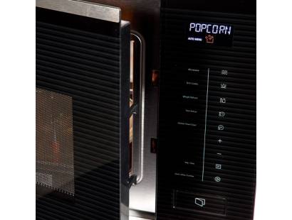 Close-up of touch control panel with illuminated auto programme options