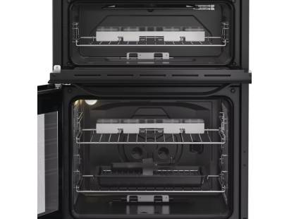 Freestanding Hotpoint HTG6GDCB1 cooker with glass lid and four-burner hob