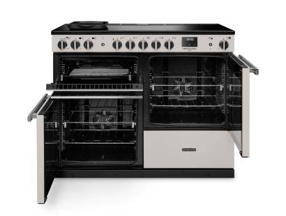 Front view of Rangemaster Professional Deluxe 110 Ivory Induction Range Cooker showing oven doors and controls
