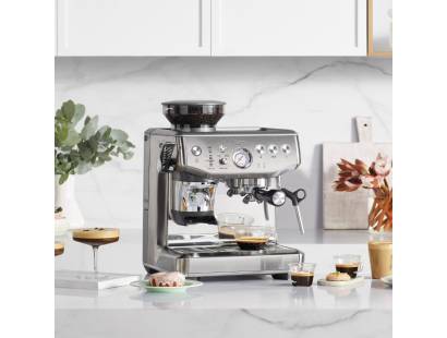 Front view of Sage Barista Express Impress espresso machine in stainless steel finish