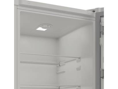 Interior of Indesit INKS1361W4UK fridge with LED lighting and Fresh Space drawer