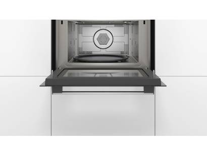Interior view of Bosch CMA583MS0B with glass turntable and grill