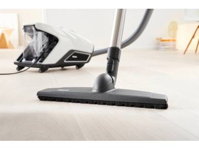 Miele CX1COMFORT cleaning multiple surfaces including tile and carpet