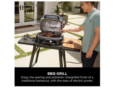 Ninja OG901UK Woodfire Pro Connect XL Electric BBQ Grill & Smoker on a patio
