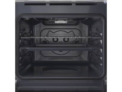 Open view of Indesit IO232HW showing interior shelves and bright oven lighting