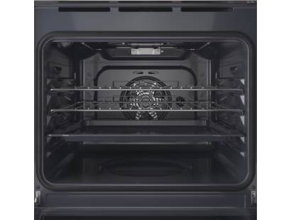 Open view of Indesit IO233XUK oven showing shelves and interior lighting