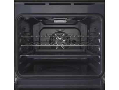 Open view of Indesit IO253BUK showing spacious 71L interior and shelving