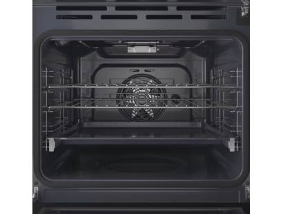 Open view of Indesit IO278P1XUK oven showing interior with racks and large drip tray