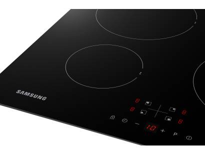 Samsung NZ64F3NM1ABUR induction hob close-up showing control panel and cooking zones