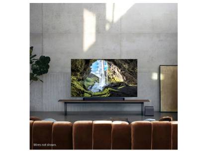 Samsung Q990F rear speaker and subwoofer setup in modern living room