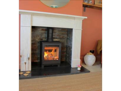 Woodford Pankhurst 5kW stove installed in living room with flue pipe