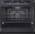 Open view of Indesit IO278P1XUK oven showing interior with racks and large drip tray